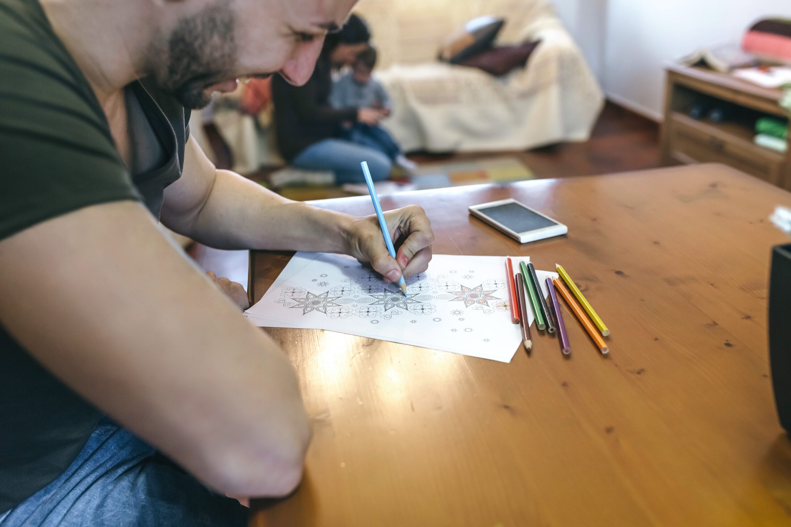 Young man coloring mandalas